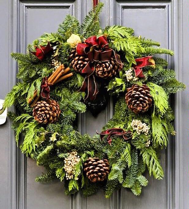 wreath hanging on a gray door
